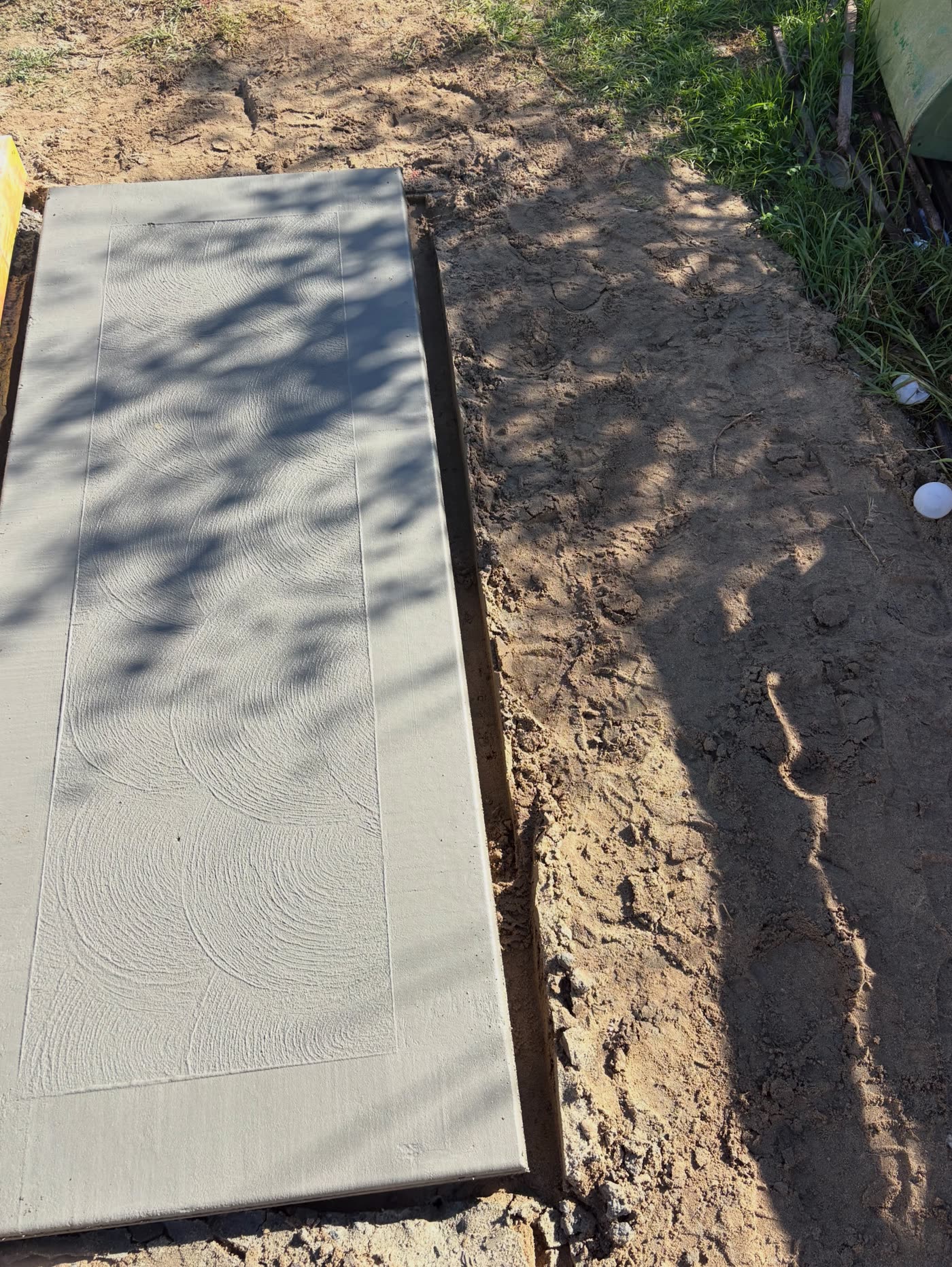The separate smoker pad on the same Padbury job, poured and swirl-floated